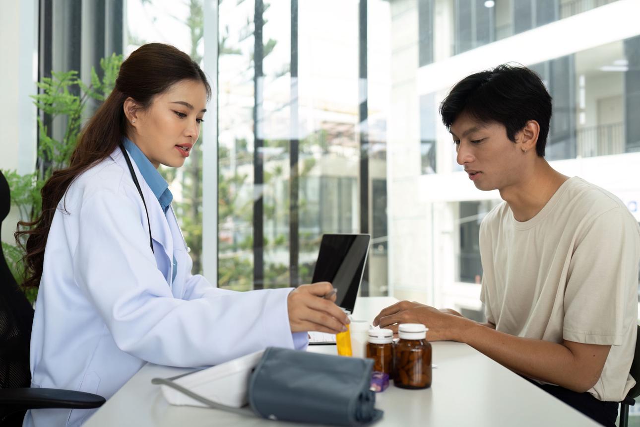 Healthcare Professional Consulting with Patient About Medications